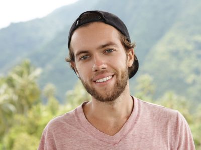 outdoor-shot-young-caucasian-man-with-beard-relaxing-open-air-surrounded-by-beautiful-mountain-setting-rainforest